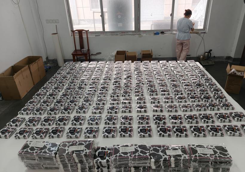 Napkin packs laid out on factory floor for pre-shipment inspection